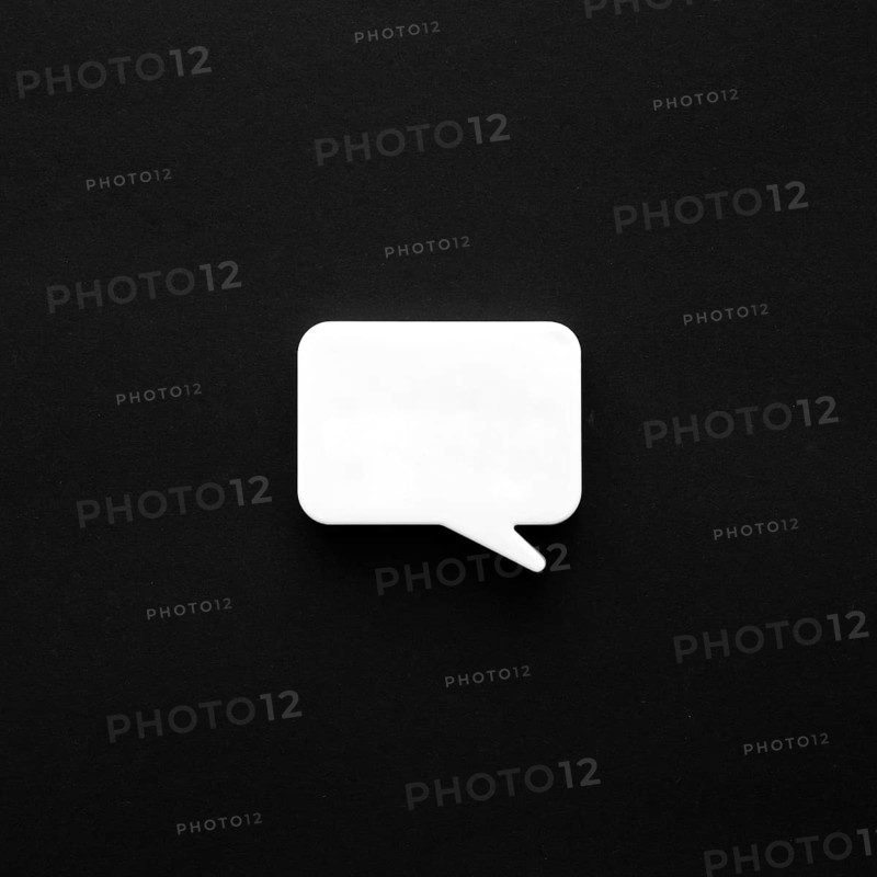 Dark surface with chat bubble