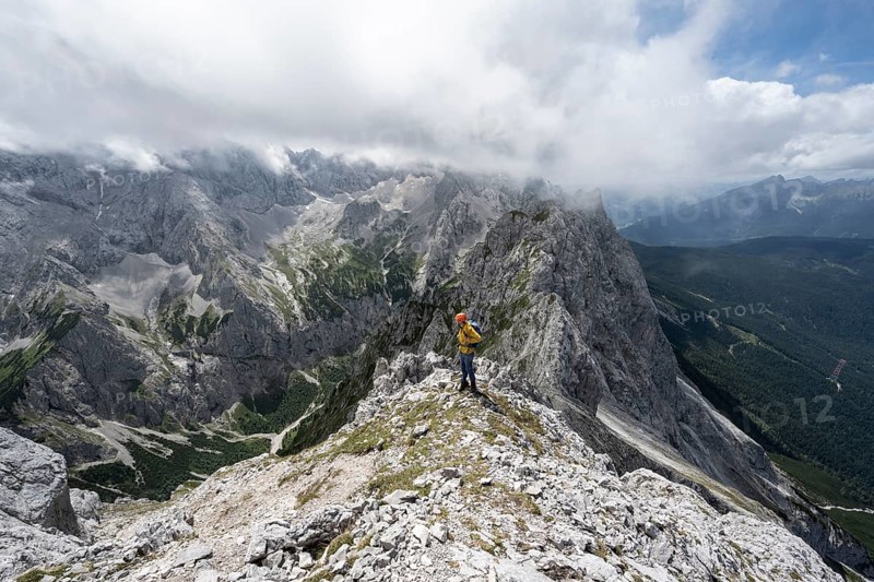 Mountaineer at the summit of the Waxenstein