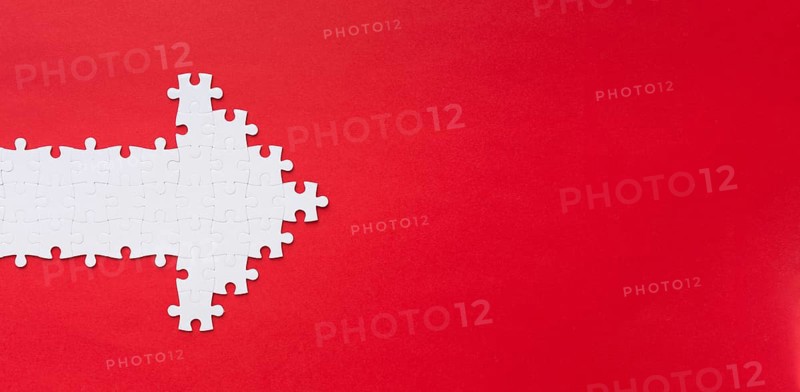 Puzzle pieces arrow with copy space