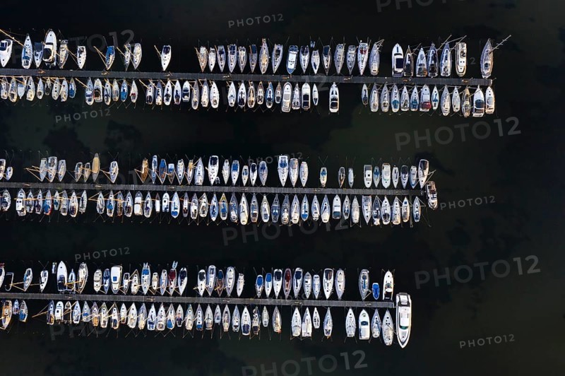 Aerial view over jetties with sailing boats at marina in harbour of Heiligenhafen along the Baltic Sea