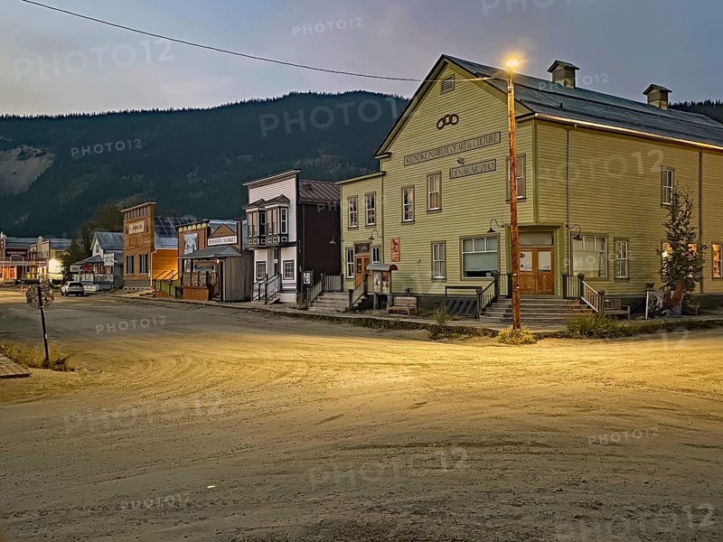 Historic wooden houses and wooden boardwalks in the gold mining town of Dawson City