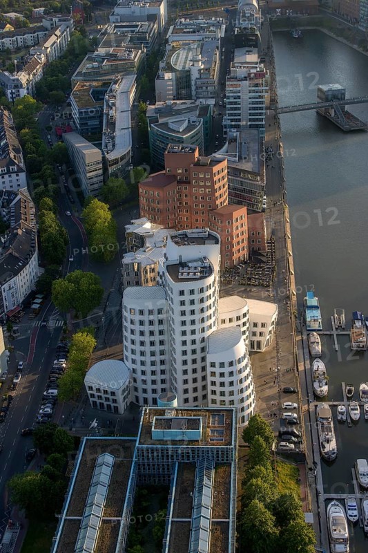 View from the Rhine Tower of the modern architecture of the Neuer Zollhof building and Gehry buildings next to the Duesseldorf Marina and the Media Harbour