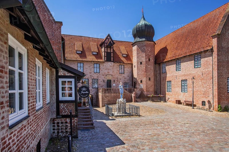 Inner courtyard with Roland statue of Bederkesa Castle in the mud spa