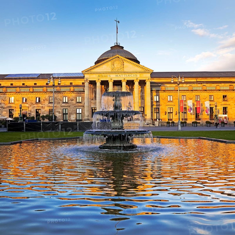Spa hotel and Casino in late evening light with cascade fountain