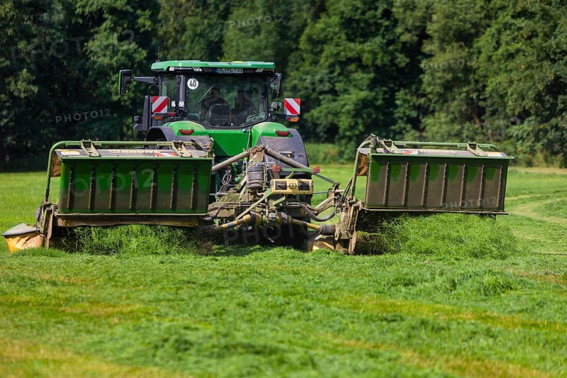 Grass mowing in a small field near Waldheim with a John Deere tractor