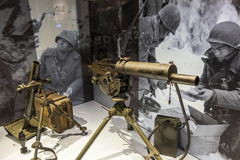 American M1917 Browning machine gun and M2 Mortar in the Bastogne War Museum devoted to the Second World War Two Battle of the Bulge in the Belgian Ardennes