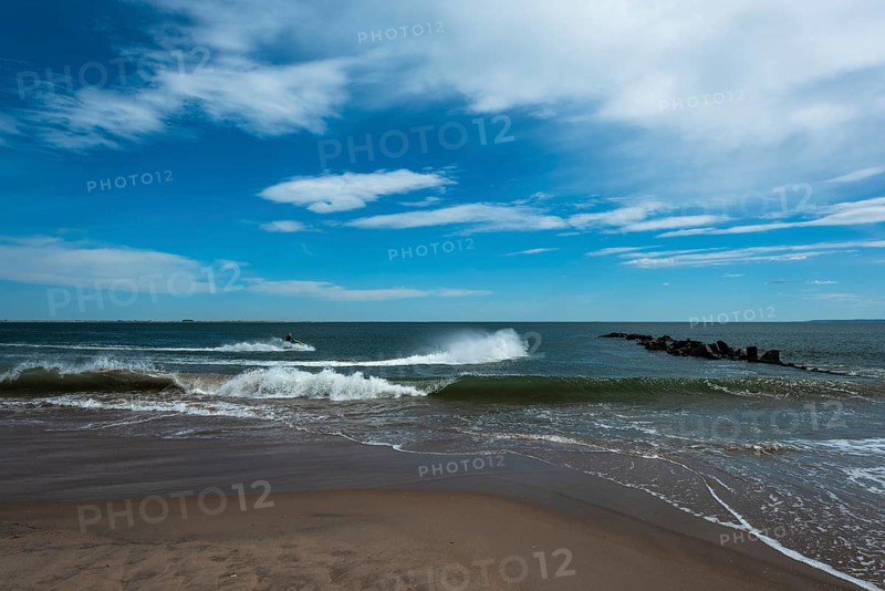 Listening to the ocean waves on a sunny spring day on the Brighton Beach