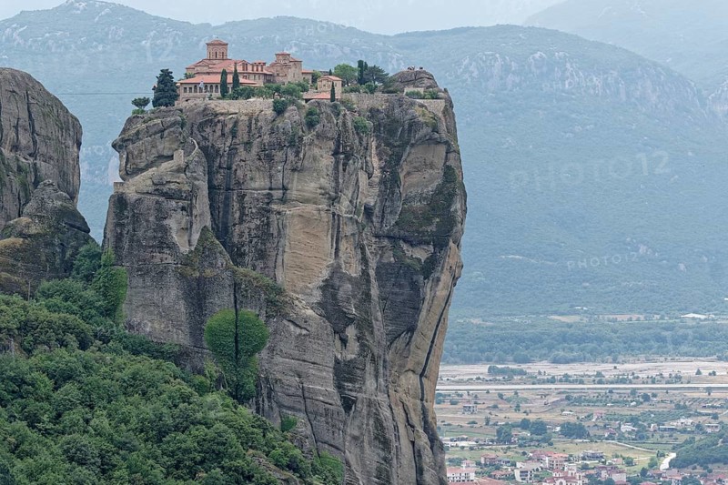 The Meteora Monastery Agia Triada Holy Trinity. The Greek Orthodox Meteora monasteries are built on sandstone cliffs above the Pinios valley. They are a UNESCO World Heritage Site. Kalambaka