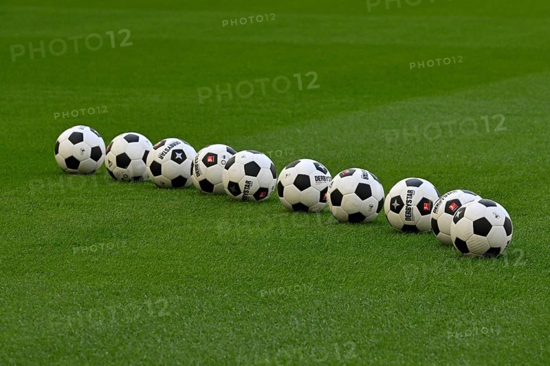 10 Adidas Derbystar footballs lie on grass
