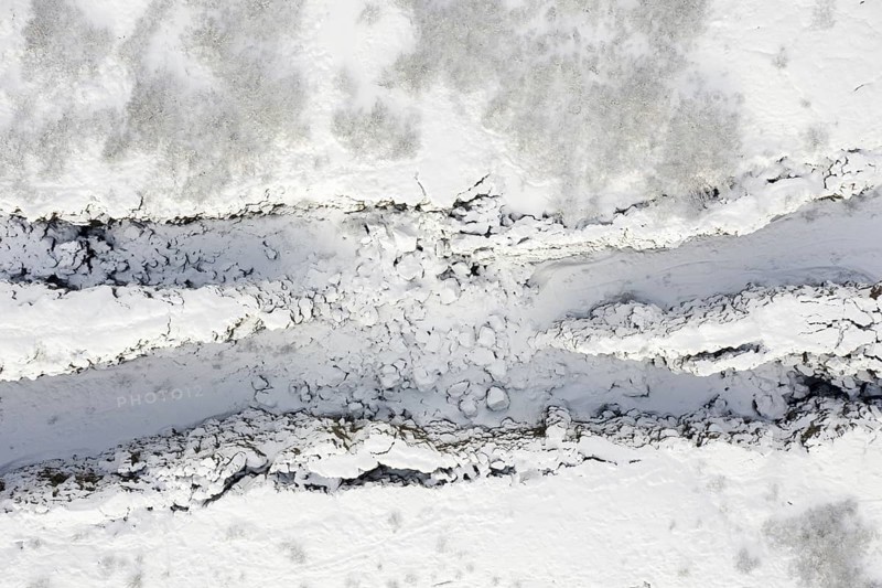Aerial view over the Almannagja Canyon in the snow in winter