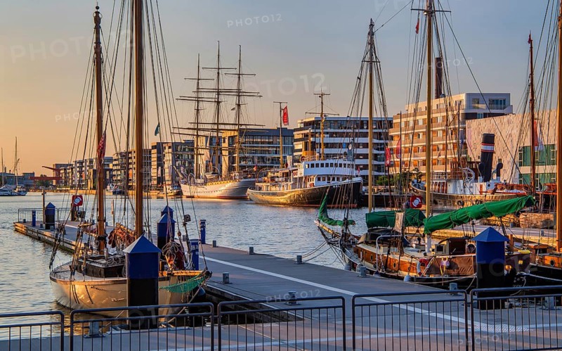 Historic icebreaker Whale and sail training ship Germany in the New Harbour in the evening sun