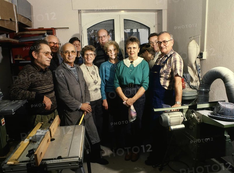 Group of pensioners produces toys for children. 80s