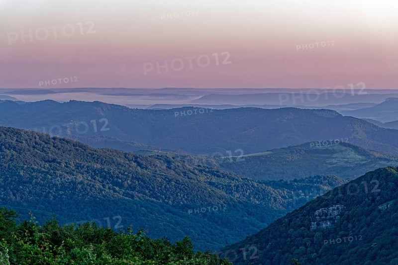 Daybreak over the mountain landscape of the Balkan Mountains and the forested slopes of the Balgarka nature park Park in Central Bulgaria. Shipka