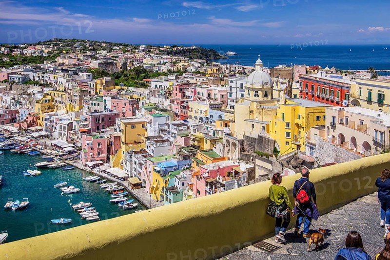 Panorama of the village with the church of Santa Maria delle Grazie and the fishing port in the bay of the fishing village of Corricella