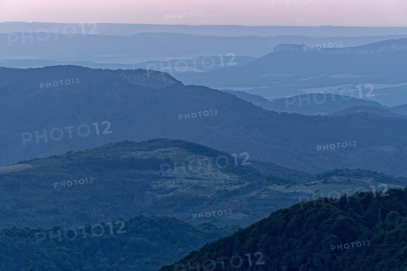 Evening mood over the mountain landscape of the Balkan Mountains and the forested slopes of the Balgarka nature park Park in Central Bulgaria. Shipka
