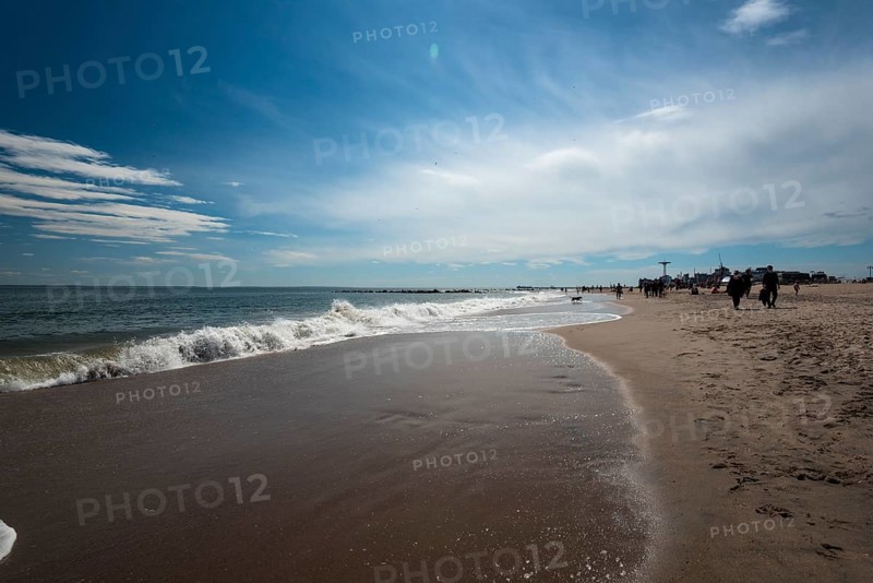 Listening to the ocean waves on a sunny spring day on the Brighton Beach
