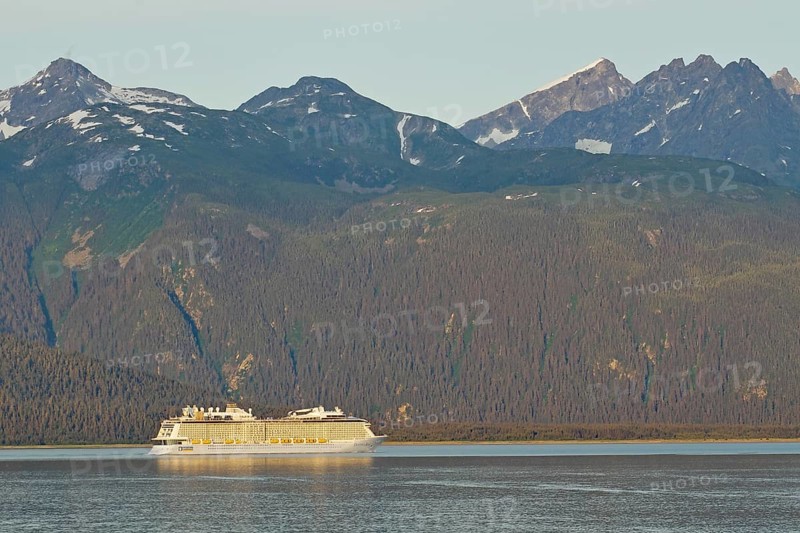 Cruise ship in front of high mountains