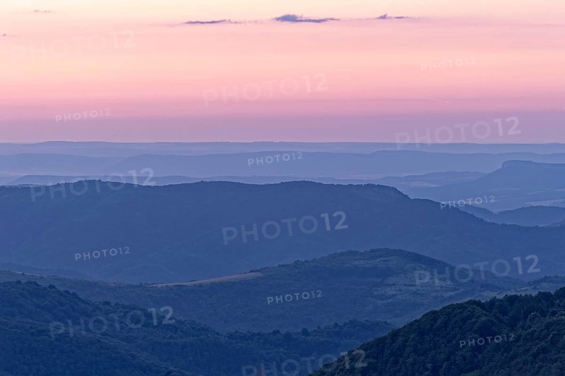 Evening mood over the mountain landscape of the Balkan Mountains and the forested slopes of the Balgarka nature park Park in Central Bulgaria. Shipka