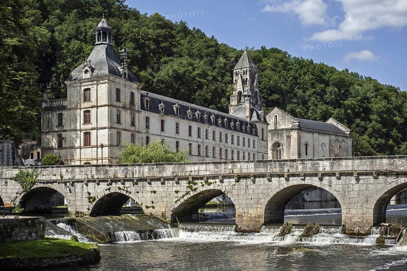 The Benedictine abbey abbaye Saint-Pierre de Brantome and its bell tower along the river Dronne
