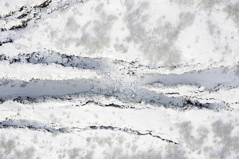 Aerial view over the Almannagja Canyon in the snow in winter