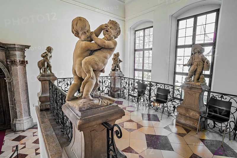 Child fighting with juvenile satyr