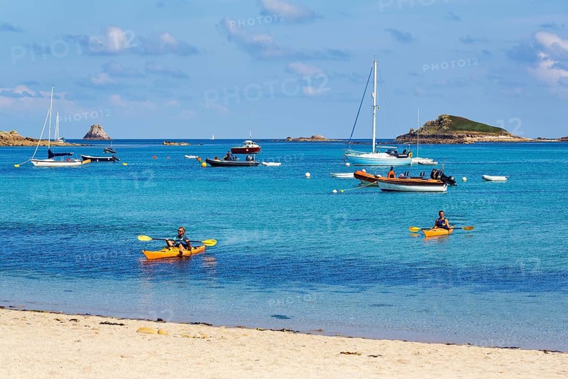 Kayakers and boats off the coast