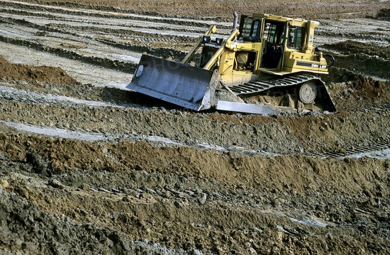 Navvy work done by bulldozer on construction site