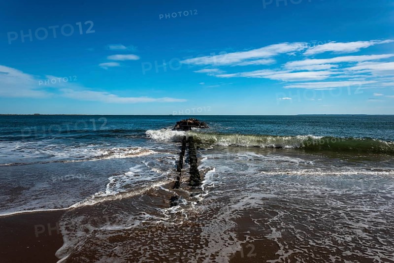 Listening to the ocean waves on a sunny spring day on the Brighton Beach