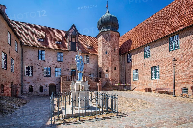 Inner courtyard with Roland statue of Bederkesa Castle in the mud spa