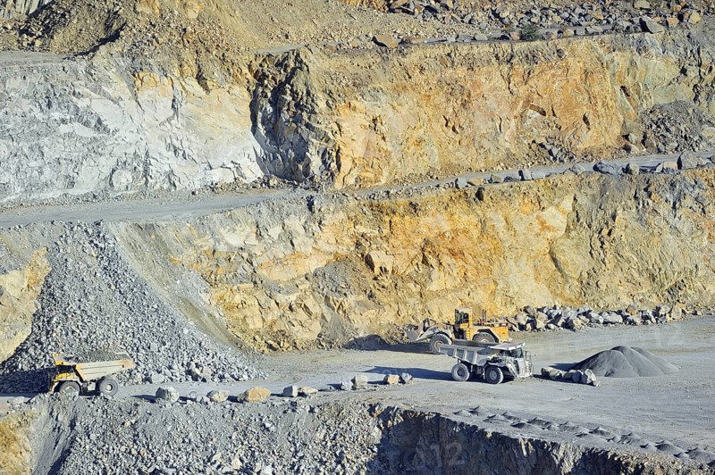 Trucks at work in porphyry quarry