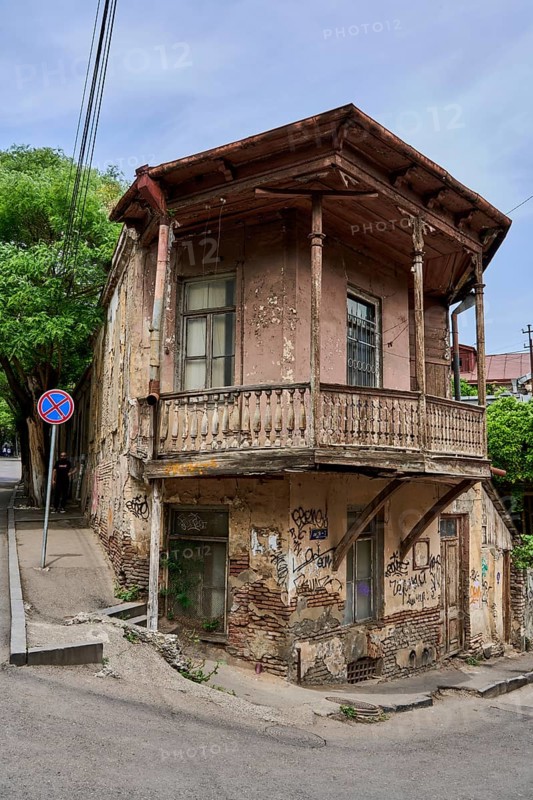 House in need of renovation with balcony