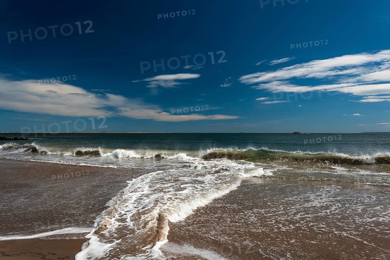 Listening to the ocean waves on a sunny spring day on the Brighton Beach