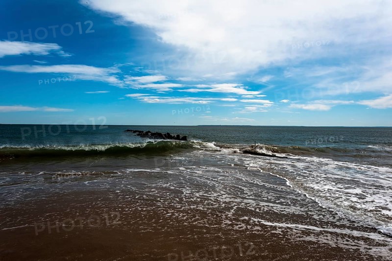 Listening to the ocean waves on a sunny spring day on the Brighton Beach