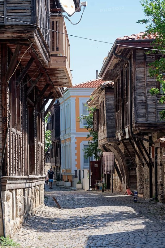 Half-timbered houses with typical roof overhang on the cobbled street in the old town. Sozopol