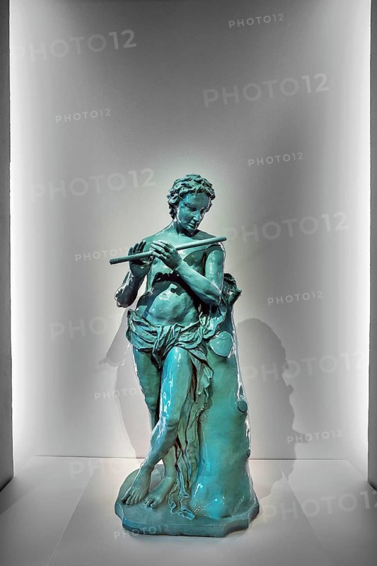 Flute player as kiln crown