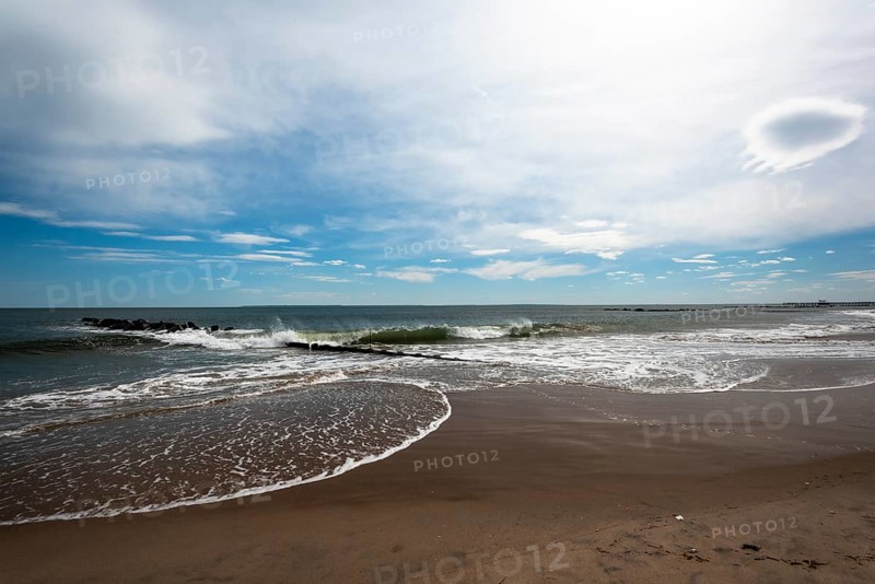 Listening to the ocean waves on a sunny spring day on the Brighton Beach
