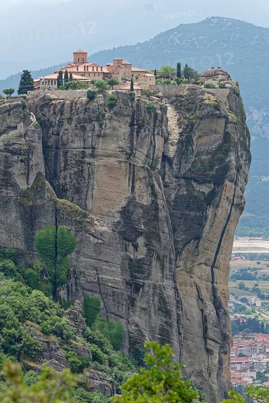 The Meteora Monastery Agia Triada Holy Trinity. The Greek Orthodox Meteora monasteries are built on sandstone cliffs above the Pinios valley. They are a UNESCO World Heritage Site. Kalambaka