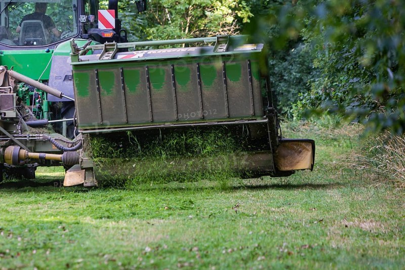 Grass mowing in a small field near Waldheim with a John Deere tractor