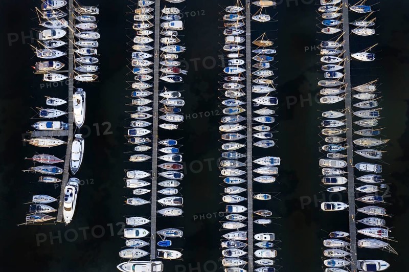 Aerial view over jetties with sailing boats at marina in harbour of Heiligenhafen along the Baltic Sea