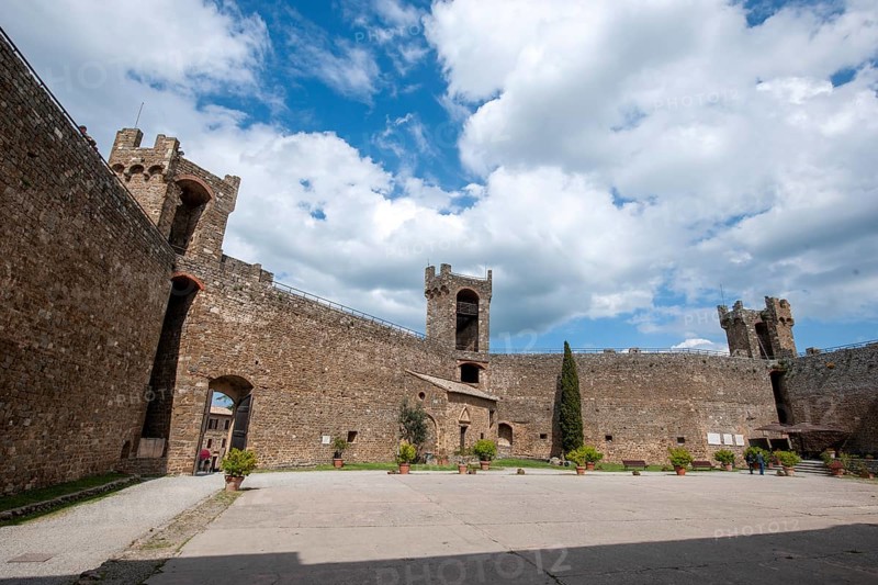 View from courtyard on fortification walls towers watchtowers of castle of Fortezza di Montalcino