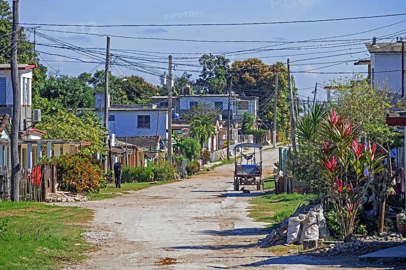 Dirt road running through rural village in the countryside of the Villa Clara Province on the island Cuba