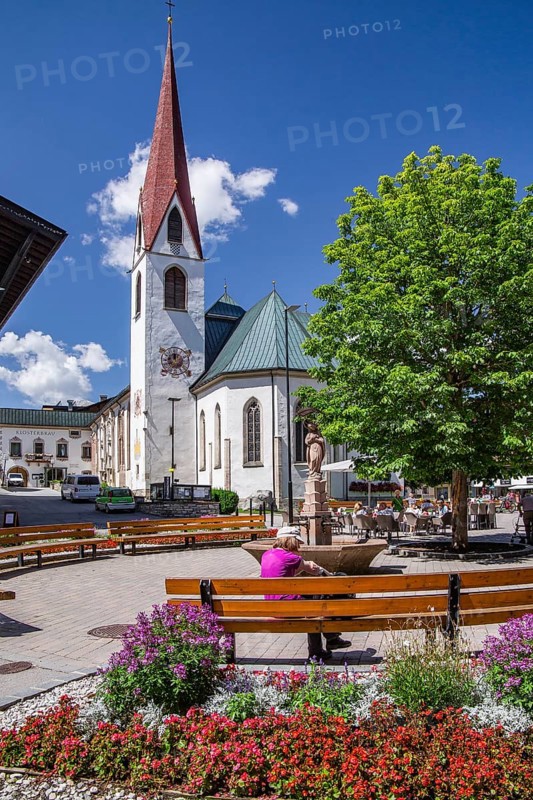 Village square with the pilgrimage church of St. Oswald