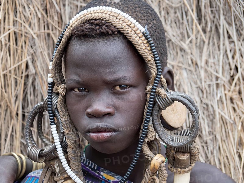 Boy from the Mursi tribe with headdress