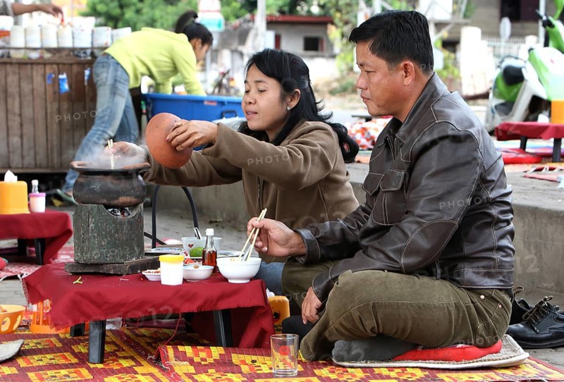 People in a roadside cookshop