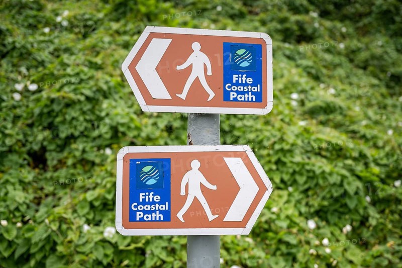 Signposts with pictograms on the Fife Coastal Path