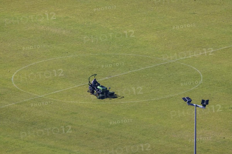 Greenkeeper maintaining the lawn