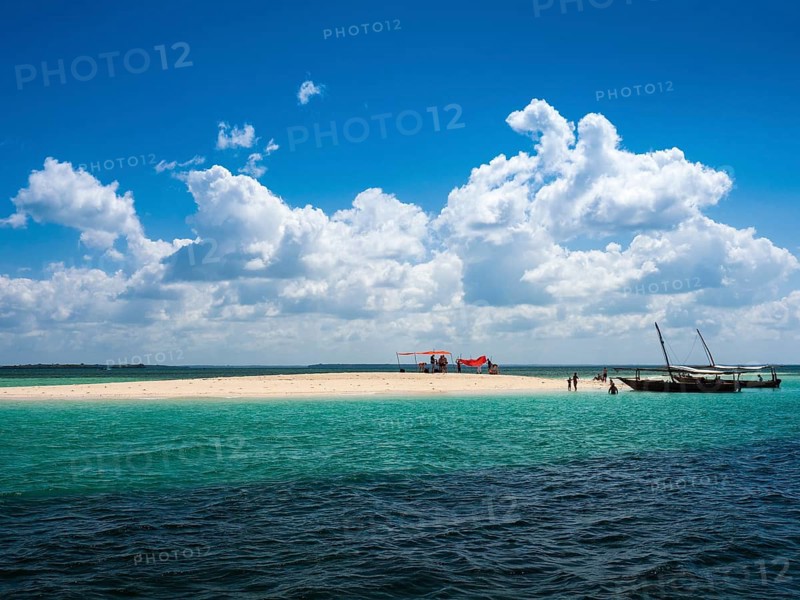Boats and sandbank in the turquoise sea