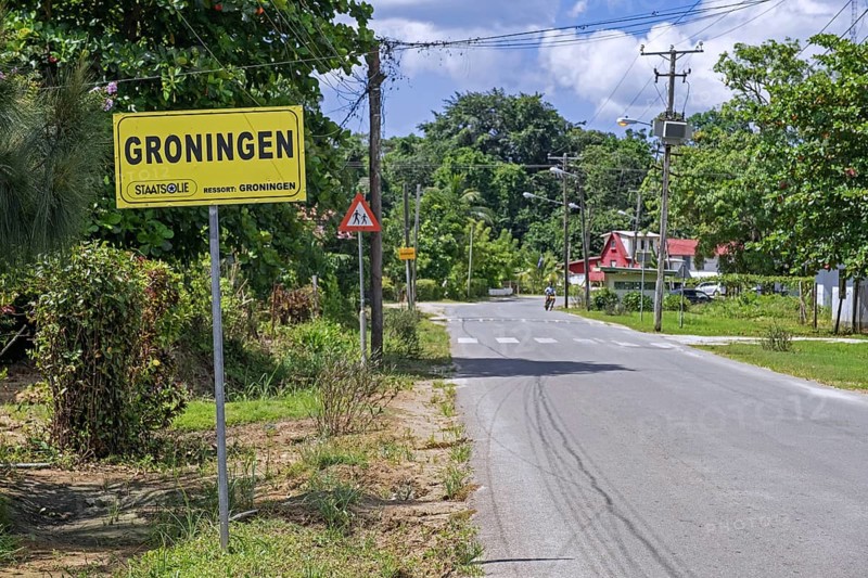 Sign and road entering the village Groningen in the Saramacca District