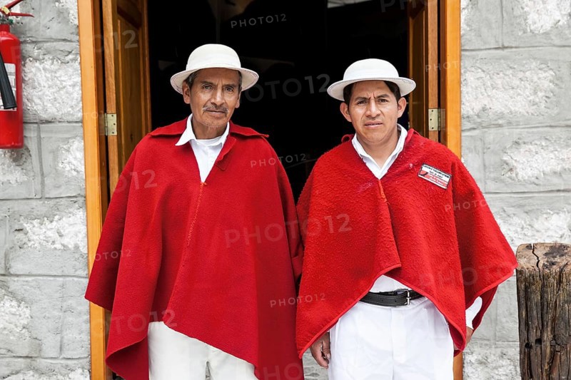 Men with red ponchos