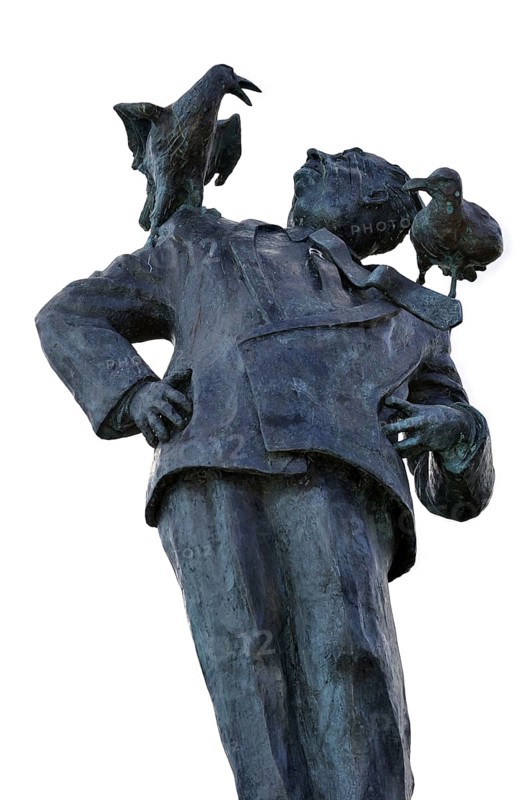 Statue of British filmmaker Alfred Hitchcock with seagulls on shoulders at Dinard